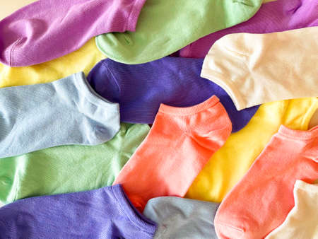 background is a lot of colorful socksの写真素材