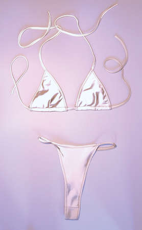 glowing fashionable swimsuit on a colored backgroundの写真素材