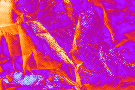 abstract textured crumpled shiny backgroundの写真素材