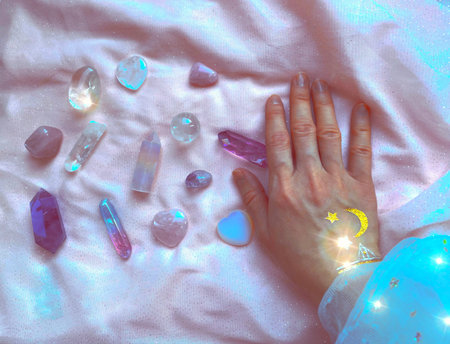 beautiful esoteric magical background. the magician's hand holds, selects the necessary crystals and minerals for a session of harmonization, crystal therapy, healingの写真素材