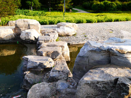 The botanical garden where sika deer is raised has beautiful flowers, the paths in the garden, the statue of sika deer, the scenery is very beautifulの写真素材
