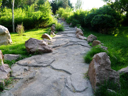 The botanical garden where sika deer is raised has beautiful flowers, the paths in the garden, the statue of sika deer, the scenery is very beautifulの写真素材