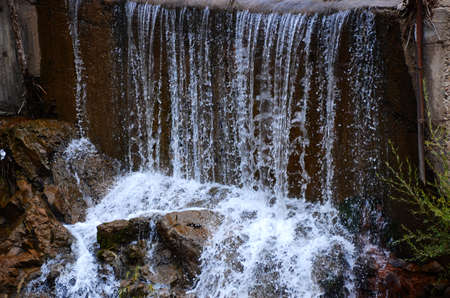 Fun in the mountains, cute goats, beautiful mountains, blue sky, and creeksの写真素材