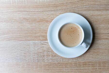 Coffee in white cup on wooden background, Breakfast conceptの写真素材