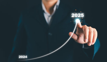 Businessman hand drawing arrow line with increasing direction from year 2024 to 2025 for forecasting...