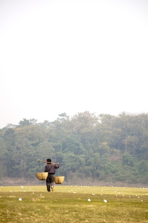 A Chinese farmer walked from the golf courseの写真素材