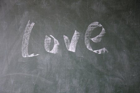 love title drawn with chalk on blackboardの写真素材