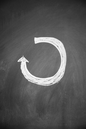 arrow drawn with chalk on blackboard
