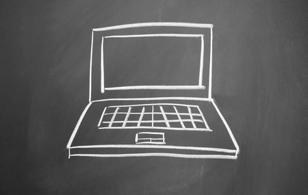 computer notebook drawn with chalk on blackboardの写真素材