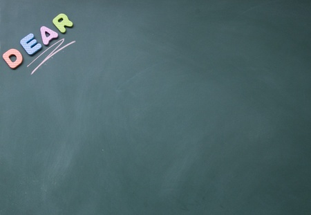 dear title written with chalk on blackboardの写真素材