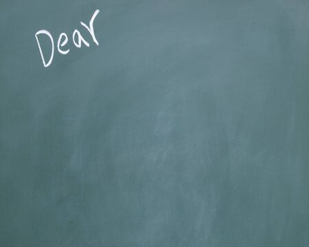 dear title written with chalk on blackboard の写真素材