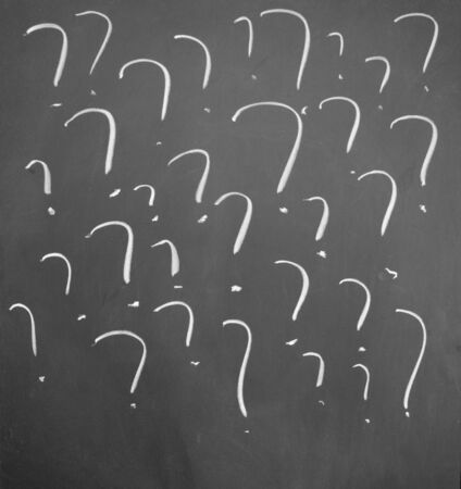 Question mark drawn with chalk on blackboardの写真素材