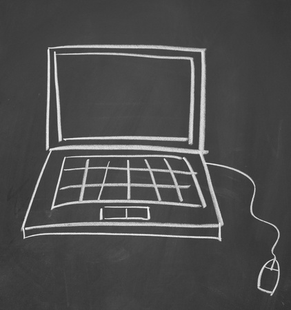 Notebook computer drawn with chalk on blackboardの写真素材