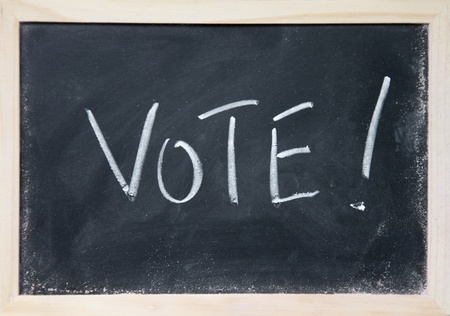 vote title written with chalk on blackboardの写真素材