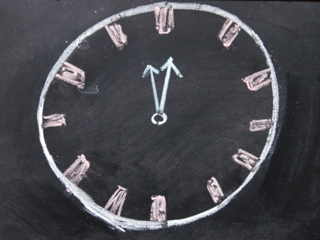 clock drawing on the blackboardの写真素材