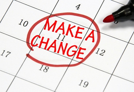 make a change sign written with pen on paperの写真素材