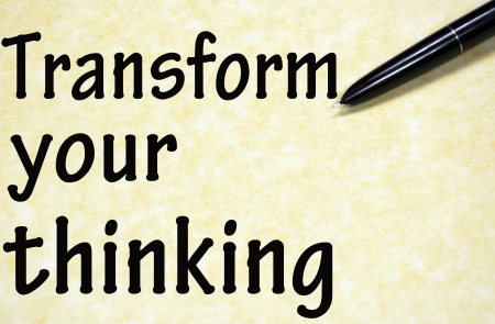 transform your thinking title written with pen on paperの写真素材