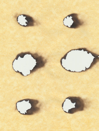 combustion hole in paperの写真素材
