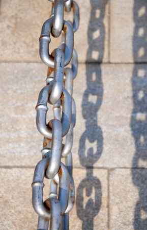 iron chain with shadowsの写真素材