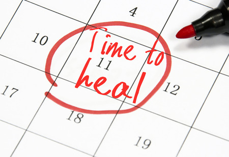 time to heal text write on paperの写真素材