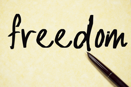 freedom text write on paperの写真素材