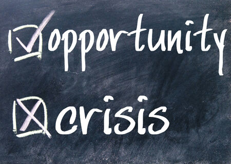 opportunity and crisis choice on blackboardの写真素材