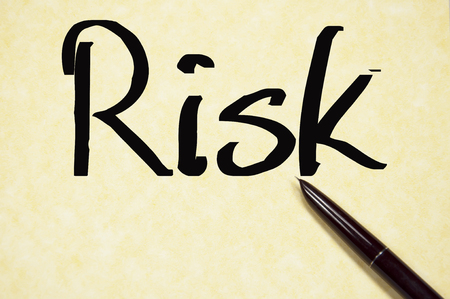 risk word write on paperの写真素材