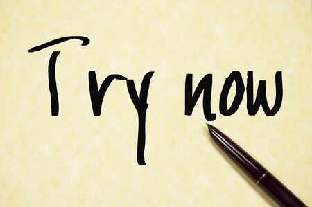 try now sign on paperの写真素材