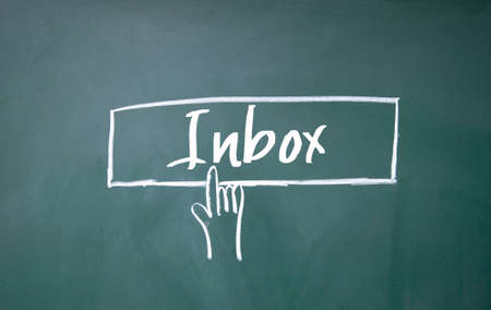 abstract finger click inbox sign on blackboardの写真素材