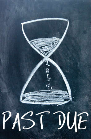 past due sign on blackboardの写真素材
