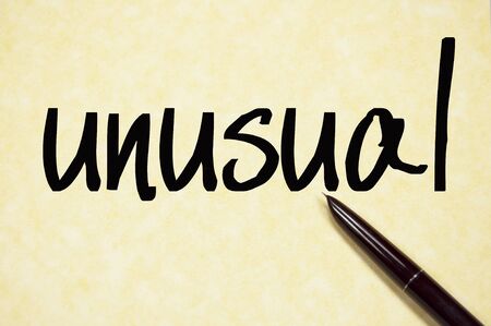 unusual word write on paperの写真素材