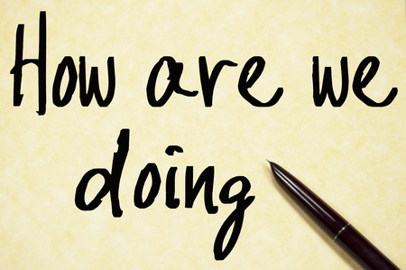 how are we doing text write on paperの写真素材