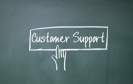 abstract finger click customer support sign on blackboardの写真素材