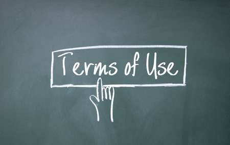abstract finger click terms of use sign on blackboardの写真素材