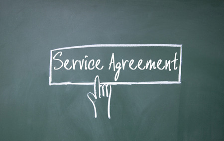 abstract finger click service agreement sign on blackboardの写真素材
