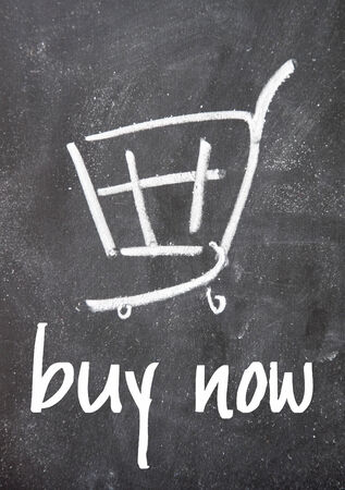 buy now sign on blackboardの写真素材