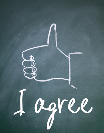 I agree sign on blackboardの写真素材