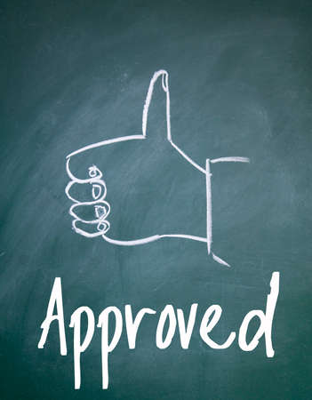 approved sign on blackboardの写真素材