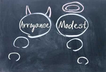 Angels and demons thinking sign on blackboardの写真素材