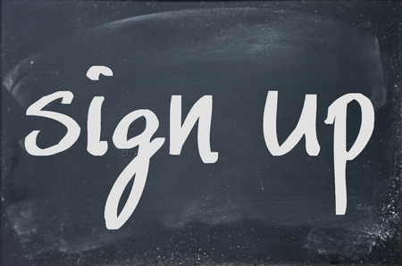 sign up text write on paperの写真素材