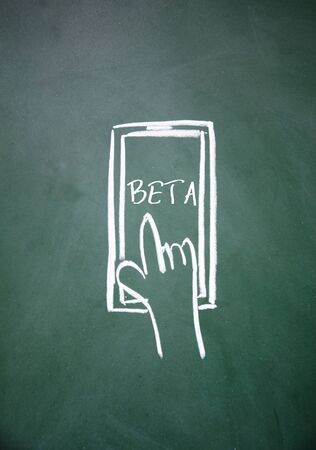 abstract finger touch phone drawn with chalk on blackboardの写真素材