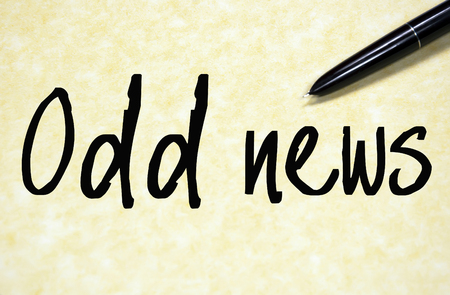 odd news text write on paperの写真素材