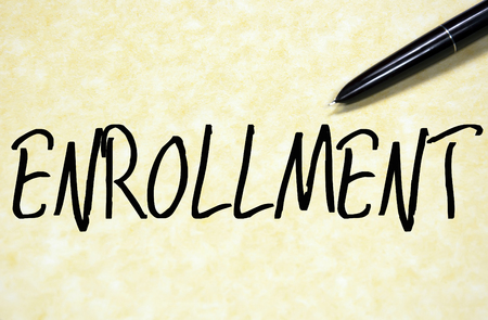 enrollment word write on paperの写真素材