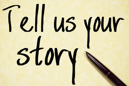 tell us your story text write on paperの写真素材