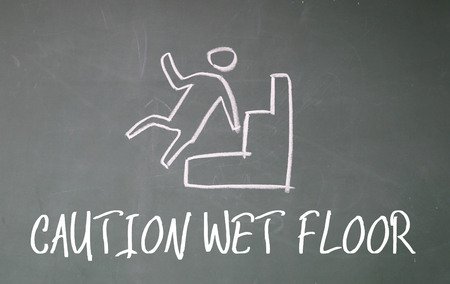 caution wet floor sign on blackboardの写真素材