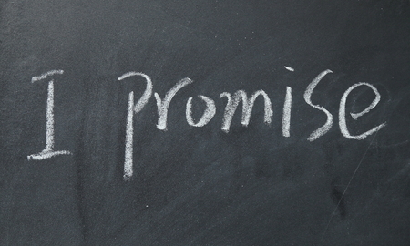 I promise text write on blackboardの写真素材