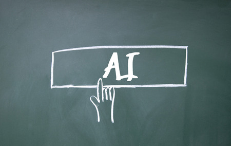 finger click AI sign on blackboardの写真素材