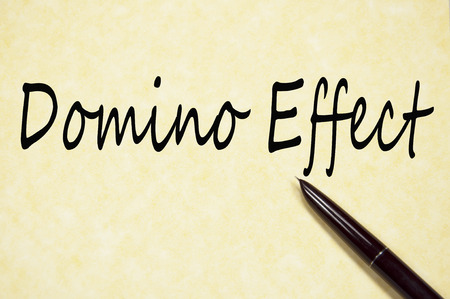Domino effect text write on paperの写真素材
