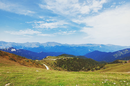Green hills on a sunny day. Mountains. Mountain range