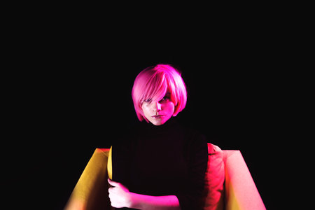 Fashion woman pink hair. Pink light. Life style
